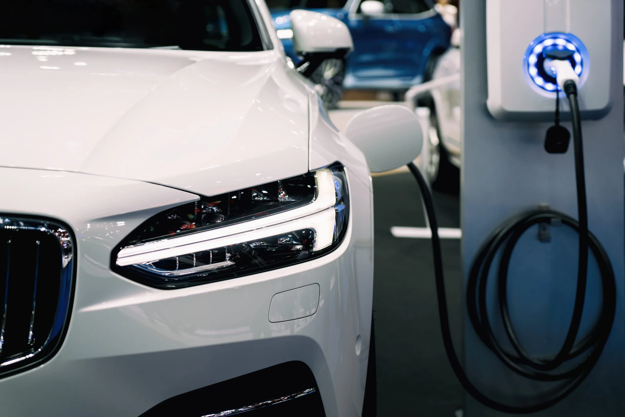 EV Charge station charging a white sedan